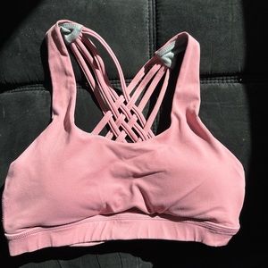 Queenieke size 4/6 sports bra, pink with grey lining criss cross back